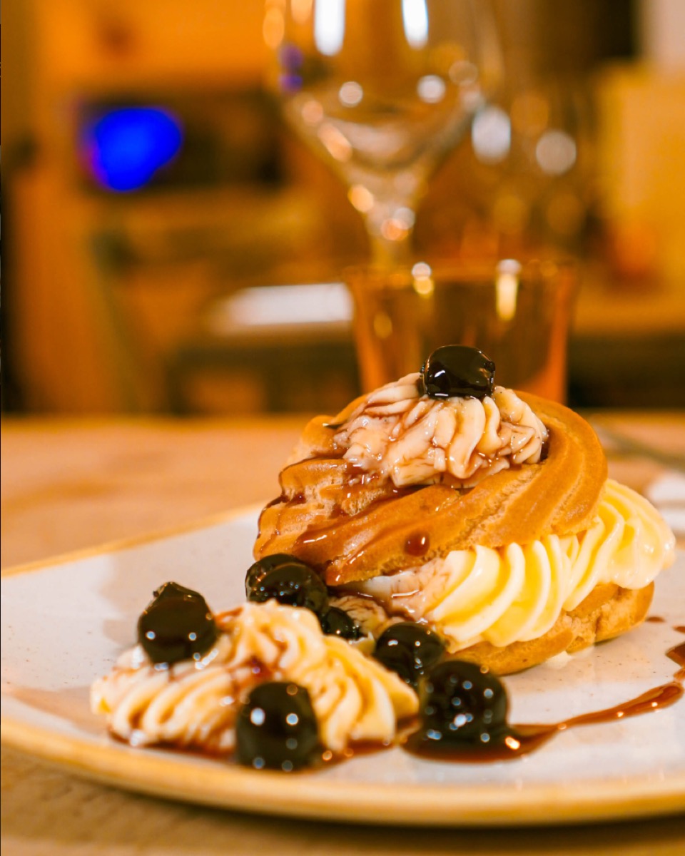 Cream puff dessert with cherries