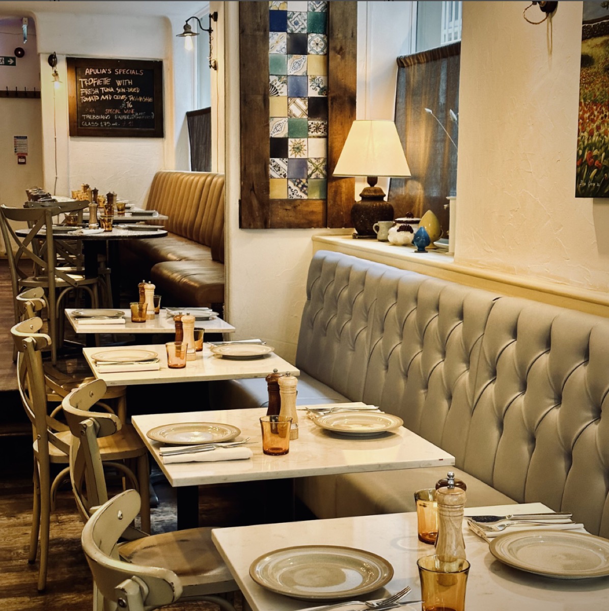 Apulia dining room with tables set for service